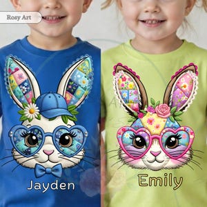 May include: Two children's t-shirts, one blue and one green, each featuring a cartoon bunny face. The bunny has patchwork ears, heart-shaped glasses, and a bow tie. The blue shirt says "Jayden" and the green shirt says "Emily".