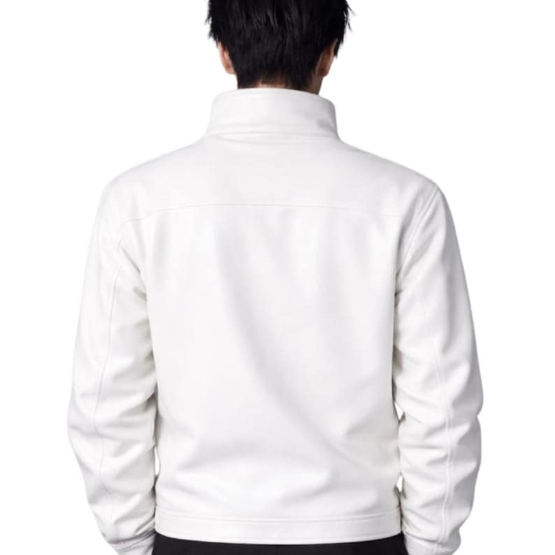 May include: A white jacket with a high collar, viewed from the rear. The jacket has a simple design with minimal stitching. The sleeves are long, and the material appears smooth. A classic, versatile piece of outerwear.