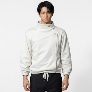 May include: A white asymmetrical zip-up jacket with a high collar and gold-coloured buttons. The jacket has long sleeves and a drawstring at the waist. The model is wearing black trousers.