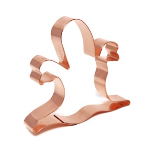 May include: A copper cookie cutter shaped like a ghost with arms outstretched. The cutter is a traditional Halloween design.