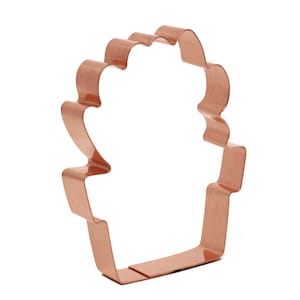 Może przedstawiać: Metalowa foremka do ciasteczek w kształcie doniczki z falowanym brzegiem.