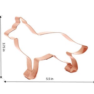 May include: A copper-colored cookie cutter shaped like a dog, measuring 5.5 inches long and 3.75 inches tall.