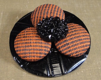 BUTTON FLOWER PIN, Orange and Black Plaid Covered Vintage Buttons, Black Glass Center