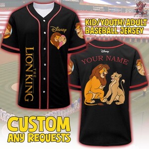 May include: Black baseball jersey featuring "The Lion King" theme. The front has the Disney logo and a heart-shaped image of Simba and Nala. The back has a Simba and Nala image and space for a custom name. Text on the jersey reads "KID/YOUTH/ADULT BASEBALL JERSEY" and "CUSTOM ANY REQUESTS."