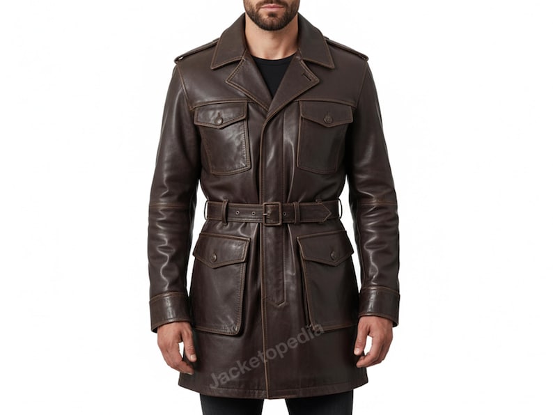May include: A brown leather jacket with a belted waist and multiple pockets. The jacket has a classic design with a collared neckline and a button-down front. The jacket is a medium length and appears to be made of high-quality leather.