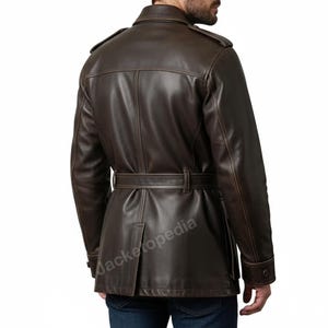 May include: A brown leather jacket with a belted waist and buttoned cuffs. The jacket has a classic trench coat design with shoulder epaulets and a notched collar. The back view shows the jacket's tailored fit and details.