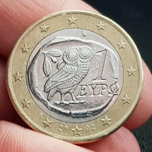 1 Euro coin with owl from Greece from 2002 with country code S in the star