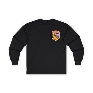May include: Black long-sleeve shirt with a small CAL FIRE logo on the upper left chest. The logo features the California state outline in yellow and red, with text in a banner above and below the outline.