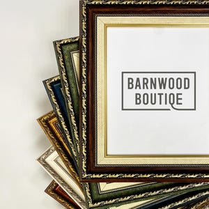 May include: A collection of rectangular picture frames in various colors, including brown, gold, green, and silver. The frames have ornate detailing and are arranged in a fan shape. The text "BARNWOOD BOUTIQUE" is visible on the center frame.