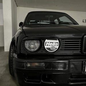 Coprifari Hella BMW: E30, E28, E21, E32, E34, E9 - Set in plastica resistente