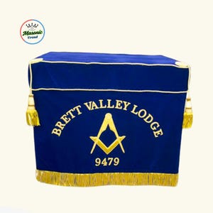 May include: A blue Masonic lodge cover with gold trim and tassels. The cover features the words "BRETT VALLEY LODGE" and the number "9479" in gold lettering, along with a Masonic symbol.