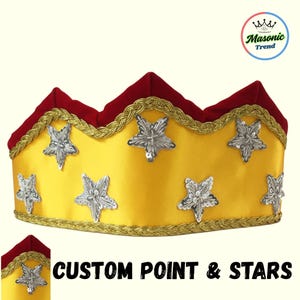 May include: A yellow crown with silver star embellishments and a red velvet top. The crown is trimmed with gold braid. The text "CUSTOM POINT & STARS" is displayed below the crown.