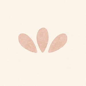 May include: A minimalist watercolor design featuring three soft, petal-like shapes in a muted rose color. The shapes are arranged in a symmetrical pattern against a cream-colored background, creating a simple, elegant floral motif.