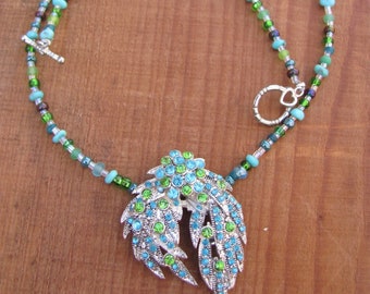 Up cycled rhinestones pendant, green and blue rhinestones mounted on assorted necklace with silver closure