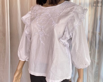 Vintage J. Crew. White cotton blouse, mid lengths sleeves, lacy shoulder frills. M/L