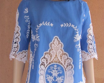 Lovely cerulean blue short sleeves blouse with white lace  embroidery