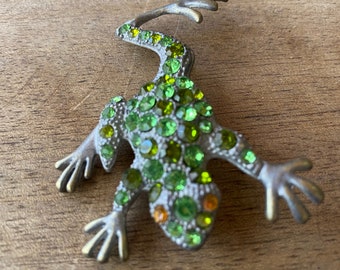 Vintage 90's - Very cute little pin frog, ( doubles as a pendant) with bright green rhinestones and  amber eyes.