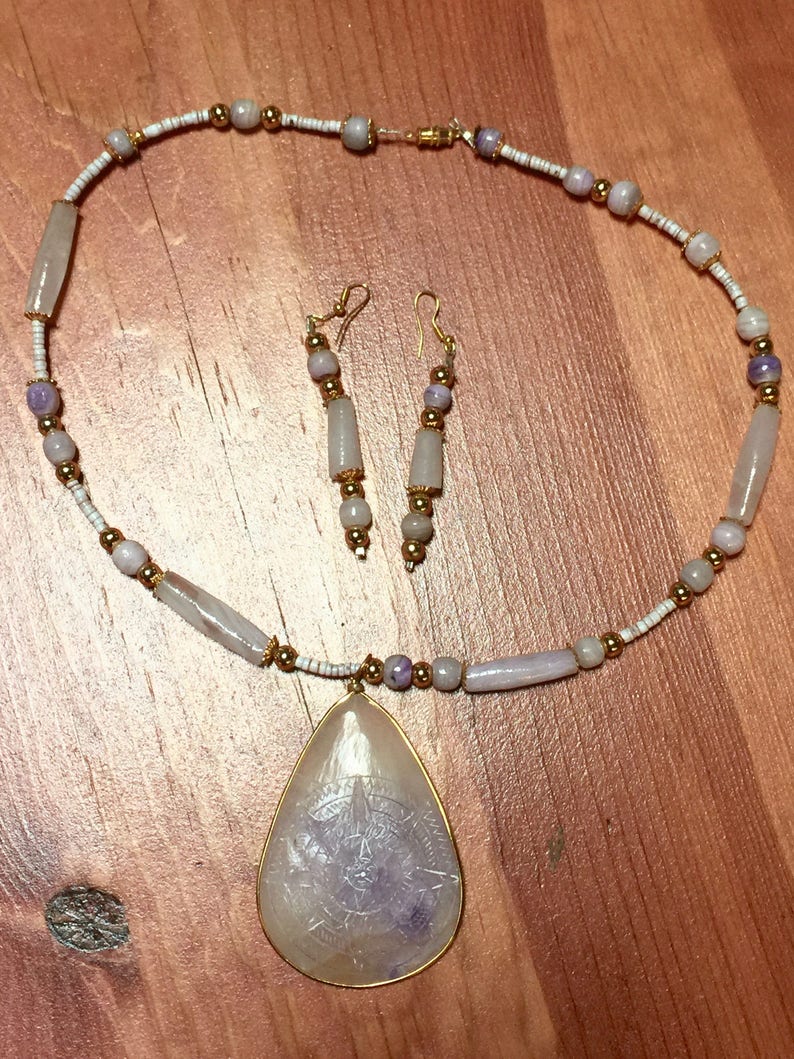Gold And Amethyst Aztec Sun Pendant Necklace With Assorted Image 0