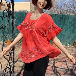 Vintage 80's - Coral orange bouse, waterfall sleeves, asymmetrical and embroidered. M/LG
