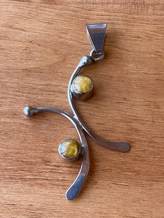 Mexican silver pendant with two small golden amber