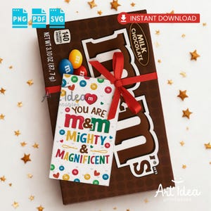 May include: A brown M&M's Milk Chocolate bar tied with a red ribbon, featuring a gift tag with the text "YOU ARE M&M MIGHTY & MAGNIFICENT". The chocolate bar weighs 87.7 grams.