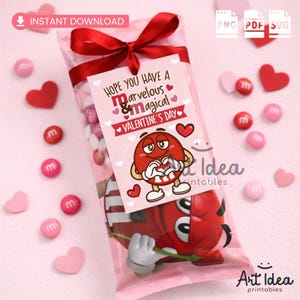 May include: A Valentine's Day-themed gift bag filled with candies, featuring a red bow and a tag that reads "Hope You Have a Marvelous & Magical Valentine's Day." The bag includes red and pink heart-shaped decorations and candies.