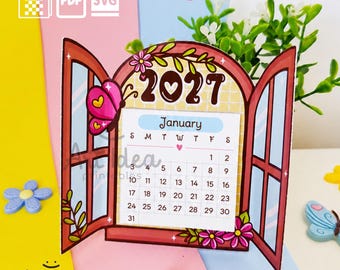 Peut inclure: Un calendrier imprimable de janvier 2027 en forme de fenêtre avec des volets ouverts, décoré de fleurs roses et d'un papillon. Le calendrier affiche le nom du mois, les jours de la semaine et les dates du 1 au 31 dans une grille.