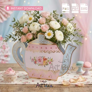 May include: A pink and blue decorative teapot-shaped floral arrangement. The teapot has floral designs and gold accents. The arrangement includes pink roses, white daisies, and greenery. Text on the image reads "Instant Download" and "Art Idea printables".