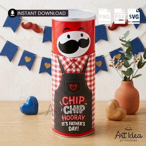 May include: A red and white Father's Day gift container with a mustache design and the words "Chip Chip Hooray It's Father's Day!" printed on it. The container is decorated with a red and white checkered shirt and a black apron.
