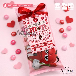May include: A Valentine's Day gift bag with a red bow, filled with M&M's candy. The tag reads "Hope you have a M&M Marvelous & Magnificent Valentine's Day." Pink and red hearts and M&M's candies are scattered around the bag.