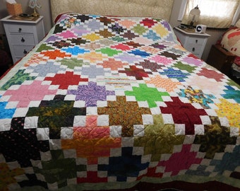 This beautiful quilt is called Colorful Squares, it is a pieced quilt, full size, machine quilted, handcrafted, unique, handmade, must have