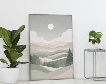May include: A framed landscape art print featuring rolling hills in shades of green, beige, and gray. A white moon and clouds are in the sky. The artwork is displayed next to a potted plant with large green leaves.