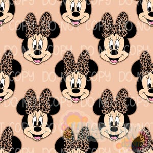 May include: A repeating pattern of Minnie Mouse faces with black ears and a leopard print bow on a peach background. The cartoon character has a smiling expression and a black nose.