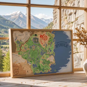 May include: A framed map of Hyrule, with a detailed illustration of the fictional land in green, brown, and blue. The map is displayed on a wooden surface near a window with a mountain view. The text "THE KINGDOM OF HYRULE" is visible.