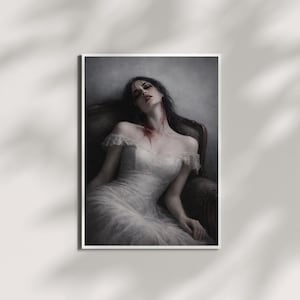 May include: A framed print of a woman in a white dress, reclining in a dark armchair. The woman has dark hair and a bloodstain on her neck. The image has a gothic, artistic style.