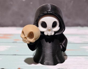 Grim Reaper Figurine Holding a Skull