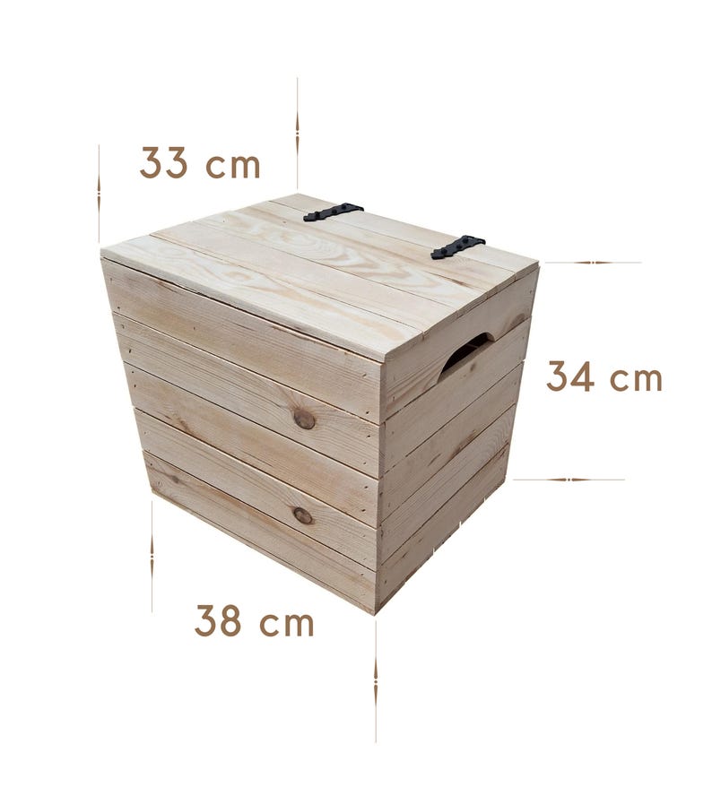 May include: A light-colored wooden storage box with a hinged lid and a handle. The box is 13 inches high, 13.4 inches wide, and 15 inches long. The lid is secured with two black metal hinges.