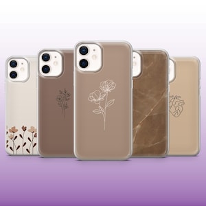 May include: Five different phone cases with various designs. The cases are clear and show a brown background with different designs. The designs include a floral pattern, a marble pattern, and a heart.