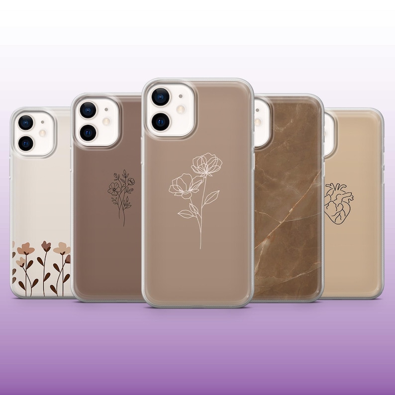May include: Five different phone cases with various designs. The cases are clear and show a brown background with different designs. The designs include a floral pattern, a marble pattern, and a heart.