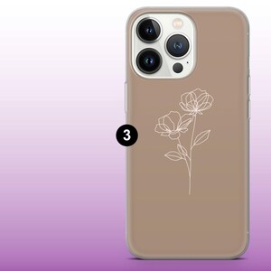 May include: A brown phone case with a white outline of two flowers. The phone case has a clear back and a raised camera bump.