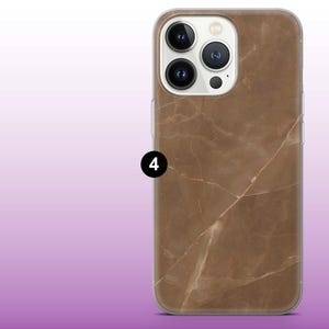 May include: A clear phone case with a brown marble pattern. The case has a raised camera bump with three lenses.