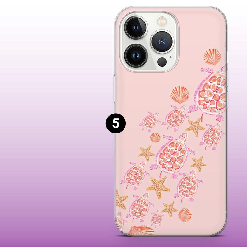 May include: A pink phone case with a clear back and a white camera bump. The case features a pattern of pink and orange sea turtles and starfish.