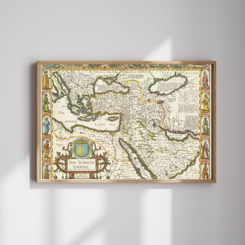 May include: A framed vintage map of the Turkish Empire, featuring detailed cartography with historical text and illustrations. The map is in shades of beige, brown, and green, with decorative borders and the title "The Turkish Empire".