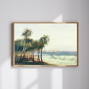 May include: A framed vintage print shows a tropical beach scene. Palm trees are on the shore, with a figure in a red dress walking along the sand. The ocean waves crash against the beach under a light blue sky.