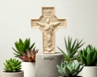 May include: A beige-colored religious cross with a detailed carving of Jesus Christ, standing on a gray pedestal. The cross is surrounded by several small potted succulents in white and beige pots, creating a serene, decorative display.