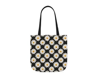 May include: A black tote bag with a white daisy pattern. The bag has black handles.