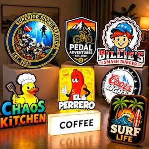 May include: A collection of eight illuminated signs featuring various designs including Superior Diving Services, Pedal Adventures, Billie's Smash Burger, Chaos Kitchen with a duck, El Perrero with a hot dog, Coors Light, a Coffee box, and Surf Life.