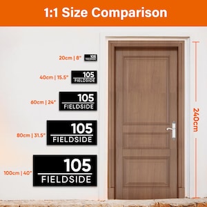 May include: A comparison of black rectangular address plaques with white text, labeled "105 FIELDSIDE", in various sizes: 8", 15.5", 24", 31.5", and 40". The image includes a wooden door and the text "1:1 Size Comparison". The door height is 240cm.