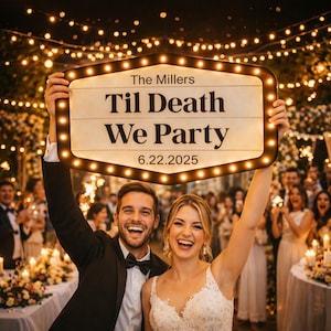 May include: A rectangular marquee sign with warm glowing bulbs around the edge, displaying the text The Millers, Til Death We Party, and 6.22.2025 in black lettering on a cream background, held up by two individuals in formal wedding attire.