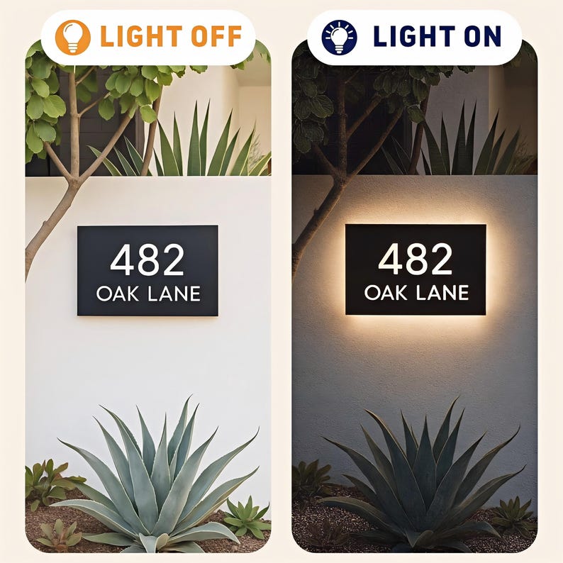 May include: Black rectangular address sign with the numbers "482" and the words "OAK LANE" in white. The sign is shown with the light off and on, illuminating the numbers and letters. The sign is mounted on a white wall with plants in front.